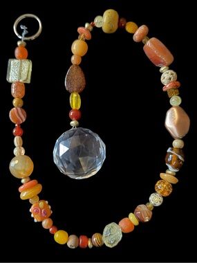 Hanging String of Orange & Yellow Beads with a Crystal Ball